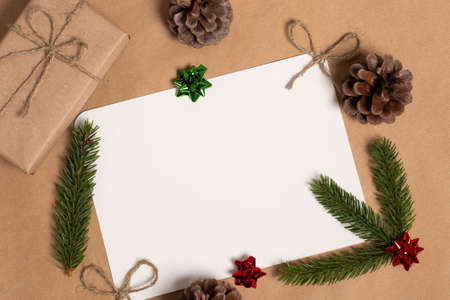 Christmas composition. Gifts, fir tree branches, red decorations. Christmas, winter, new year concept. Flat lay, top view, copy space.の写真素材