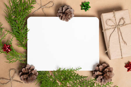 Christmas composition. Gifts, fir tree branches, red decorations. Christmas, winter, new year concept. Flat lay, top view, copy space.の写真素材