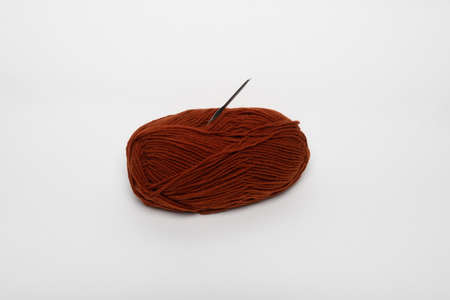 Woolen thread with a crochet. Hobby, needlework, crochet.