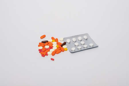 Pills, medicine. Studio image multicolored pills, vitamins. Packing of tablets.