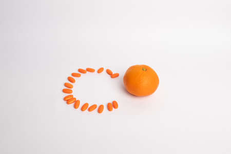 Orange pills. Mandarin orange pills with vitamins.の写真素材