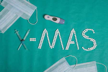 Christmas concept text X-mas with pills and snowflake. Christmas medical background.の写真素材