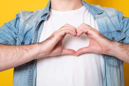 Man making a hand heart frame.の写真素材