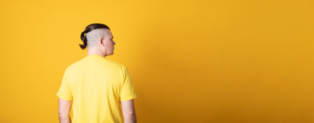 Young handsome man with a stylish haircut.  Banner copy spase.の写真素材