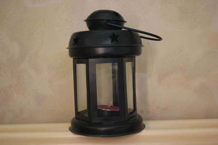 Flashlight with a candle in a romantic styleの写真素材