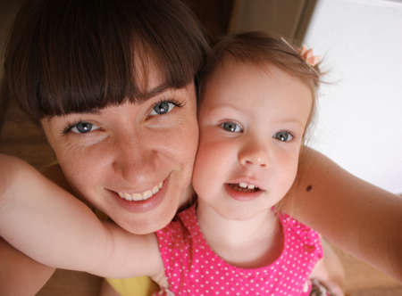 Mom and daughter glowing with happiness and loveの写真素材