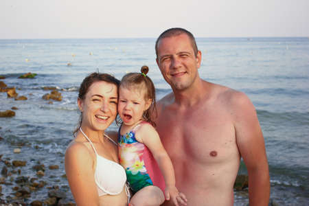 happy family on summer holiday enjoying the sea breezeの写真素材