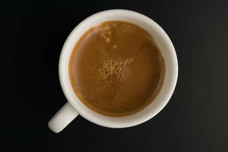 coffee on black table woodの写真素材