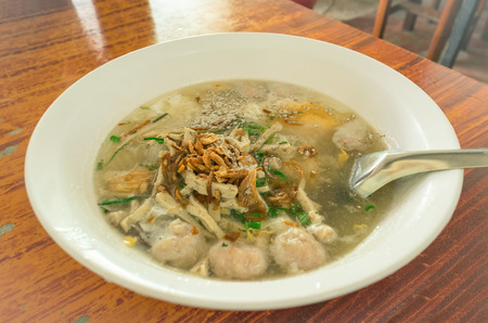 noodles soup with ingredients on table