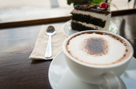 coffee cup on table wood background in blur styleの写真素材