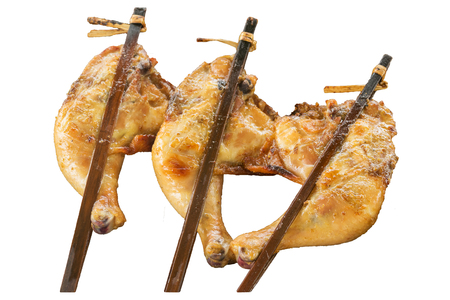 Grilled chicken in a white background isolated. Roast chicken by using bamboo.の写真素材