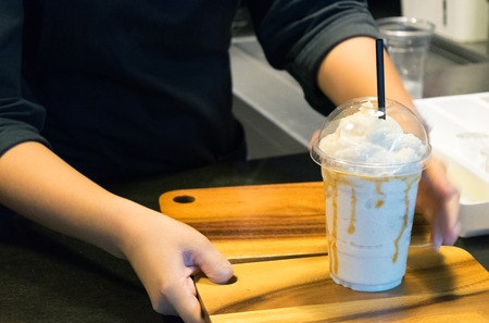 Prepare milkshake on wooden board