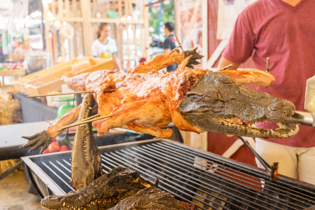 close up grilled crocodile on street food in Thailandの写真素材