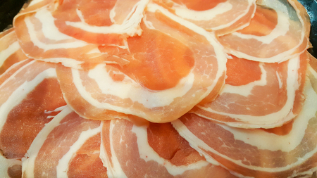 close up pork slice for cooking in plate on tableの写真素材