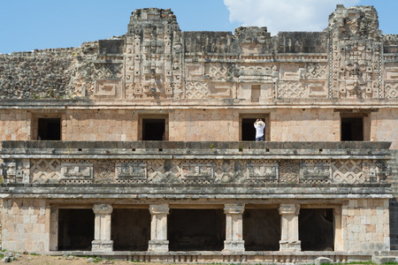 Tourist it takes photos to Uxmal Merida's pyramids Yucatan.の写真素材