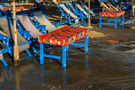 The tables and beach chairs are colorful.の写真素材