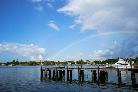 The rainbow is above the beach houses of Lantana Florida.の写真素材