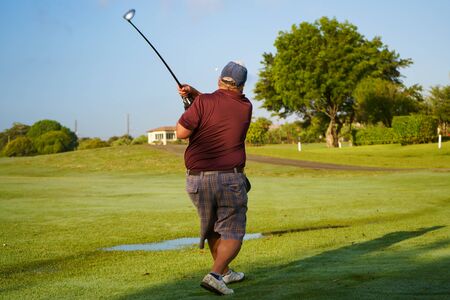 The player has hit the golf ball with great force.の写真素材
