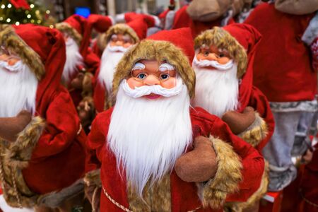 Santa Claus is in the Christmas gift shop with other friends.の写真素材