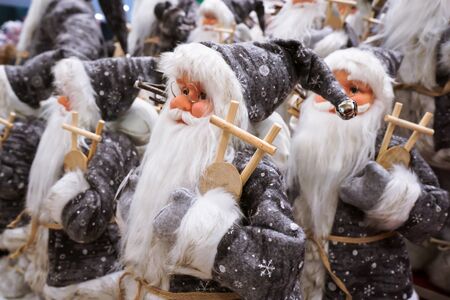 Santa Claus-like dolls are dressed in gray clothes.の写真素材