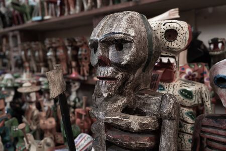 Death is represented in wooden dolls.