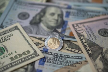 The Mexican peso is cornered by the US currency.の写真素材