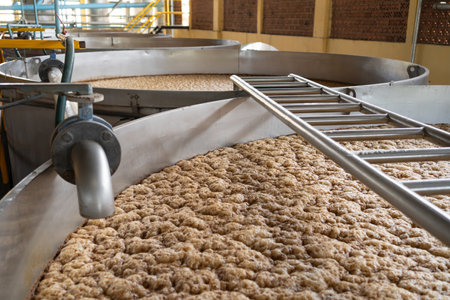 The juice of the agave or must is processing in a fermentation tank.