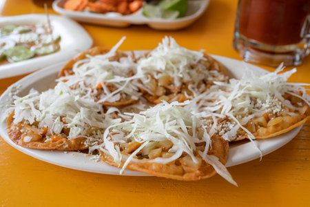Mexican food, beef gorditas with potatoes and lettuce.
