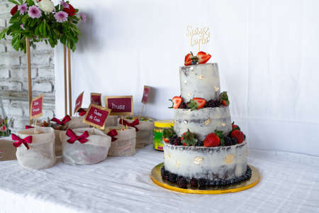 Cake and sweets are on the table for the wedding.