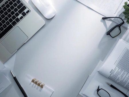 Office desk table with laptop, supplies and coffee cup. Top view with copy spaceの素材