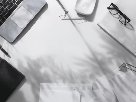 Office desk table with laptop, notebook, stationery, coffee cup. Flat lay, top view, copy spaceの素材