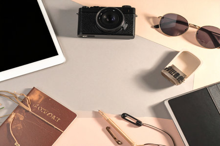 Vintage camera, notebook, eyeglasses, coffee cup and tablet on white backgroundの素材