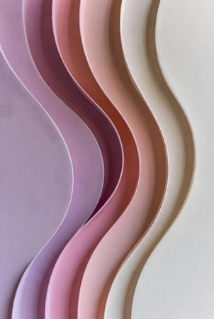 abstract background made of curved paper strips in pink and purple colorsの素材