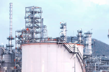 Big Industrial oil tanks in a refinery with treatment pond at industrial plants