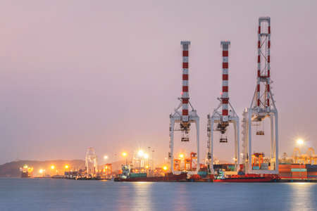 Industrial crane loading Containers in a Cargo freight ship?