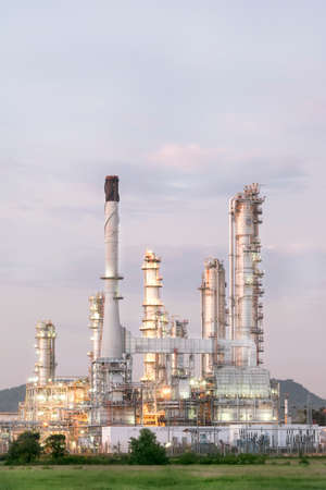 Big Industrial oil tanks in a refinery with treatment pond at industrial plants