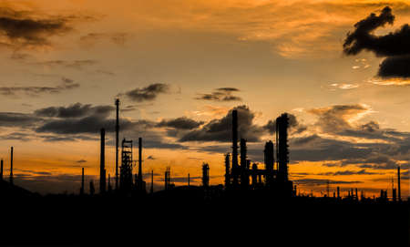 petrochemical plant in silhouette image at sun setの写真素材