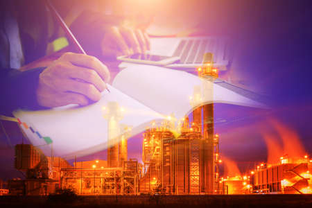 Power Plant Worker With Notebook Computer. Industrial worker with notebook working in a power plant.