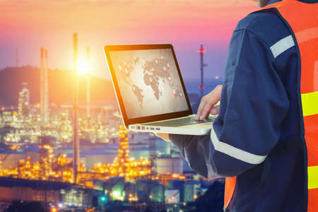 Engineer working with tablet PC near Oil Refineryの写真素材