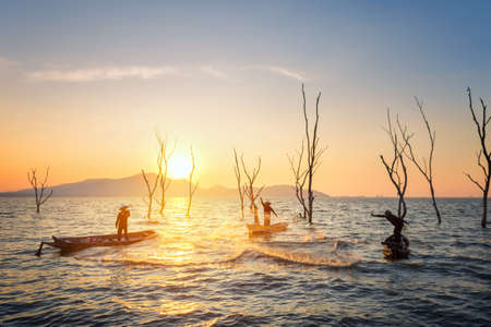 Fisherman of Bangpra Lake in action when fishing, Thailand.のeditorial素材