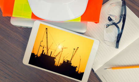 Working table engineer with tablet and tools in oil refinery industry business plantの写真素材