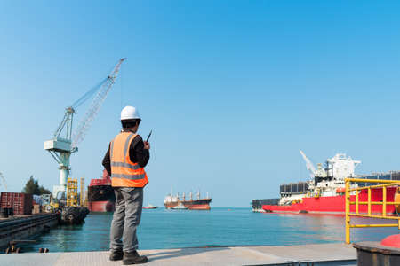 ship berthing alongside in the dock yard terminal for repairing in shipyardの写真素材