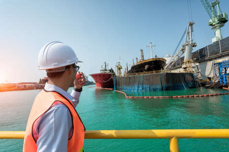 ship berthing alongside in the dock yard terminal for repairing in shipyardの写真素材