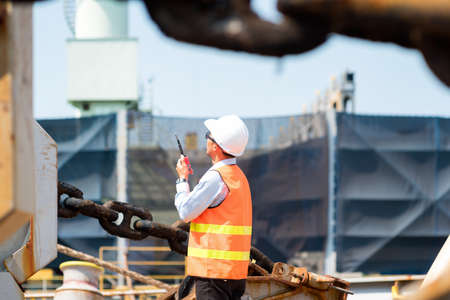 ship berthing alongside in the dock yard terminal for repairing in shipyardの写真素材