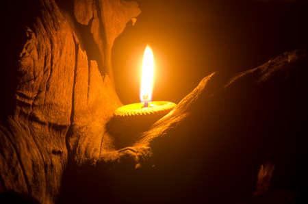 Thai candle bee wax in earthen bowl.  use for Loy Krathong Day festival in the north of Thailandの写真素材