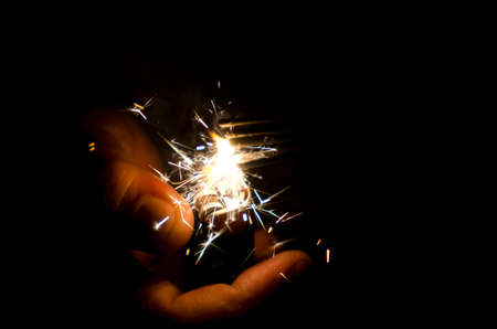 lighter and sparklers in hands