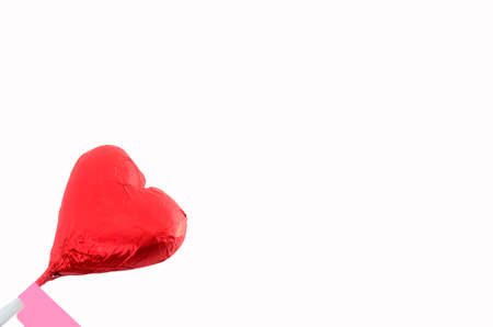 Red foil wrapped chocolate hearts for valentine's dayの写真素材