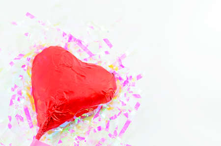 Red foil wrapped chocolate hearts for valentine's dayの写真素材