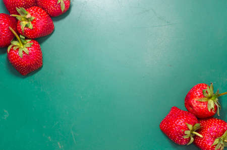 Strawberry fresh fruit on green backgroundの写真素材