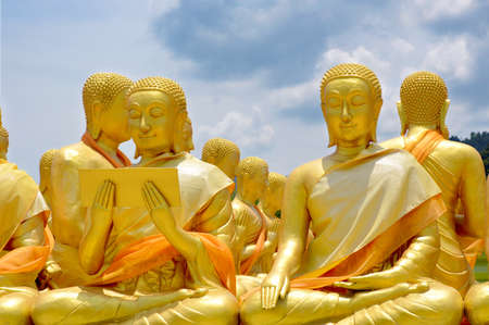 Statue of Saint Priest in Buddhism with Bright Sky Background.の写真素材